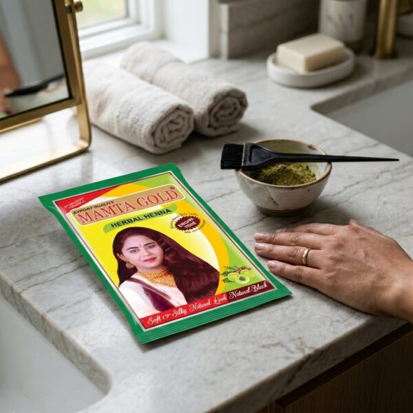 Applying Mamta Gold Herbal Henna Powder – Natural Brown Tone Hair Color on hair